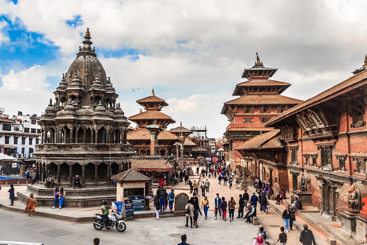 Krishna Mandir in Kathmandu, Nepal, surrounded by visitors and clear skies, representing the best time to explore Nepal.