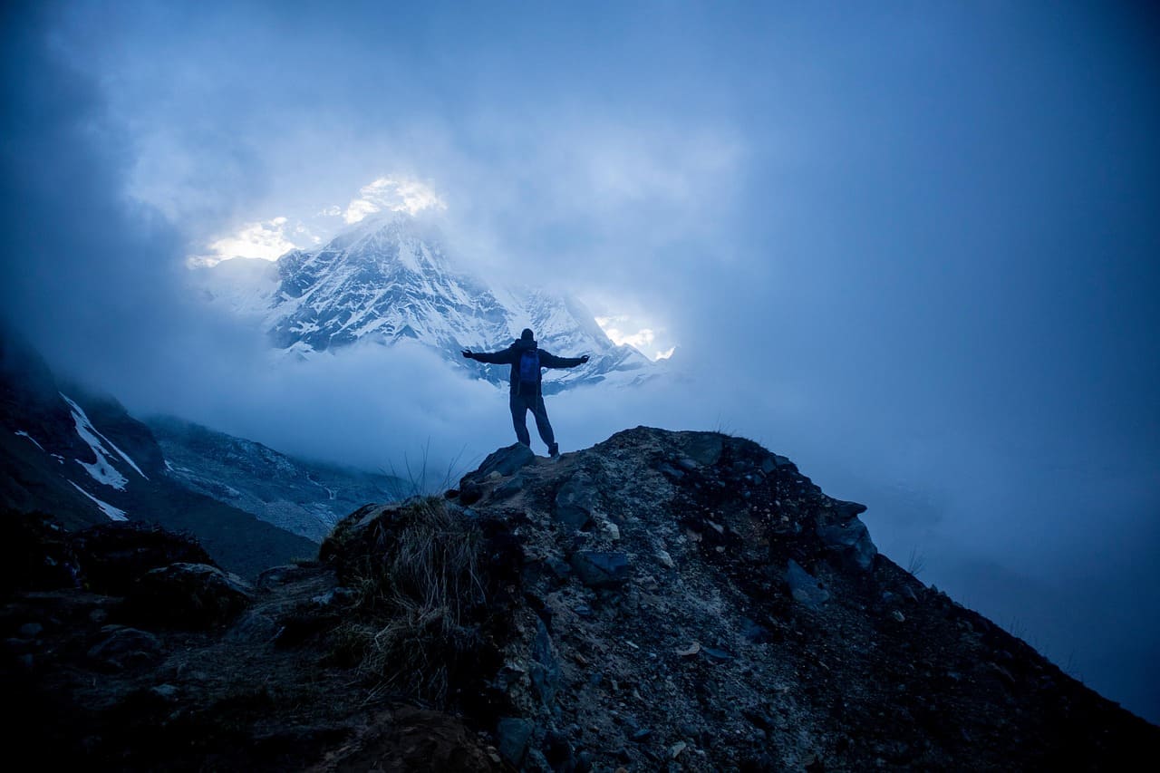 Man standing in front of the Annapurna base camp.