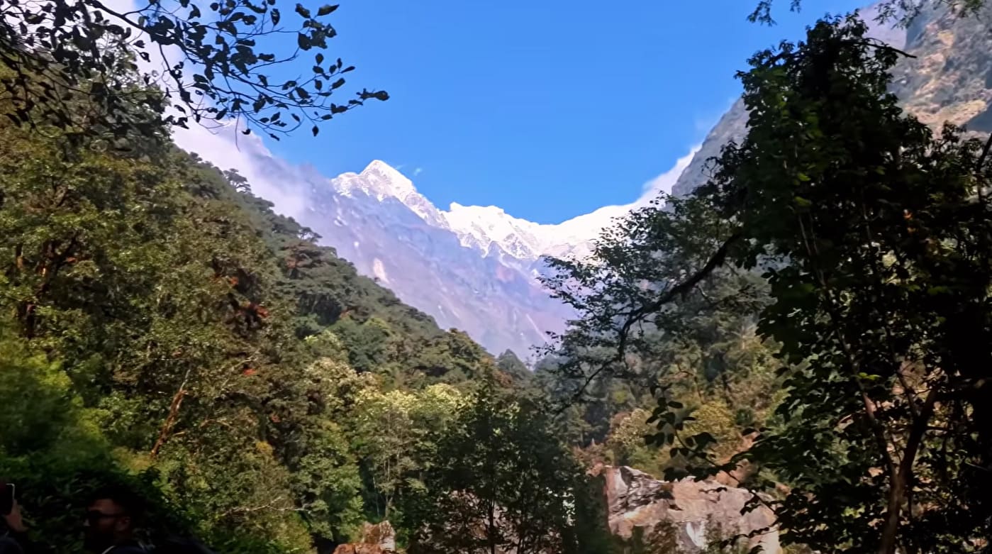 Panoramic view of the Langtang mountain ranges seen during the trek, with snow-capped peaks under a clear sky.