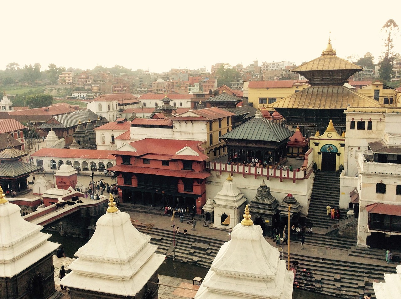 Pashupatinath Temple on the banks of the Bagmati River, featuring golden spires, sacred Hindu rituals, and vibrant pilgrims in Kathmandu, Nepal.