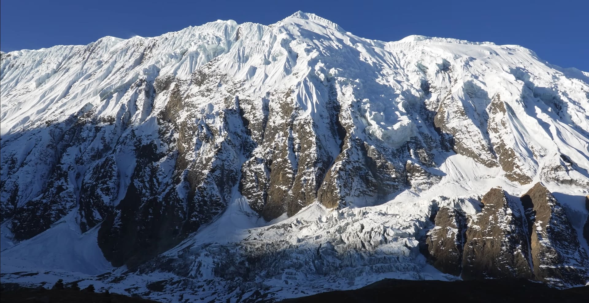 Stunning view of Annapurna massif with snow-capped peaks and clear blue sky