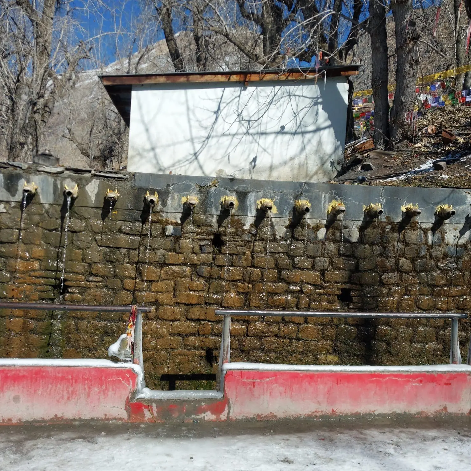 The sacred 108 water taps at Muktinath Temple, Mustang, Nepal, where pilgrims perform ritual purification as part of Hindu and Buddhist traditions.